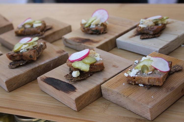 Head Cheese Rillettes sourced from the pigs at Urban Digs Farm on a flax cracker with beer mustard, pickled Klippers Organics cucumbers, and Qualicum blue cheese.