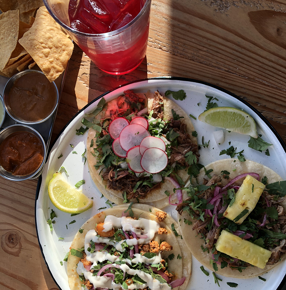 Pork, beef, and vegan tacos with hibiscus iced tea. 