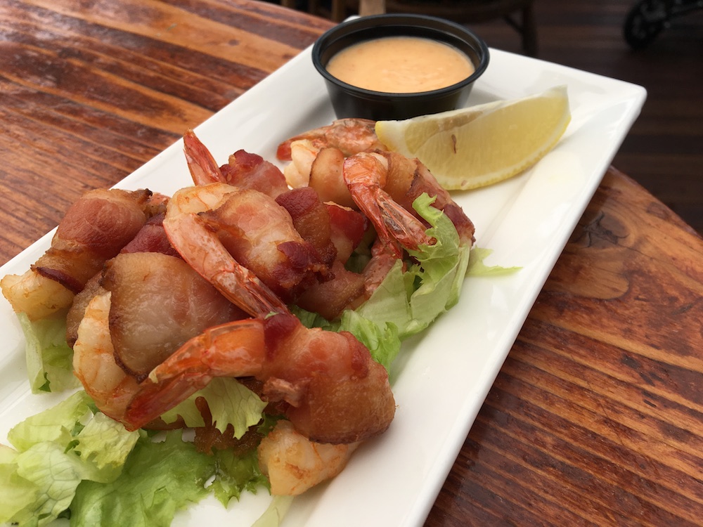 Bacon-wrapped prawns from Flying Beaver Bar & Grill. | Photo: Tara Lee