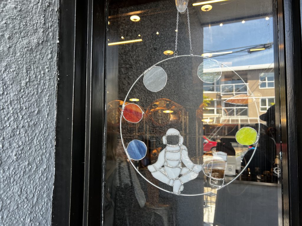 Galaxie Brewing in White Rock - window hanging of an astronaut 